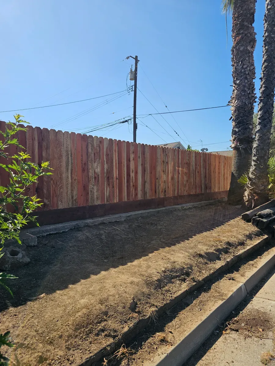 Wood fence along a cleared dirt lot in Fresno, California