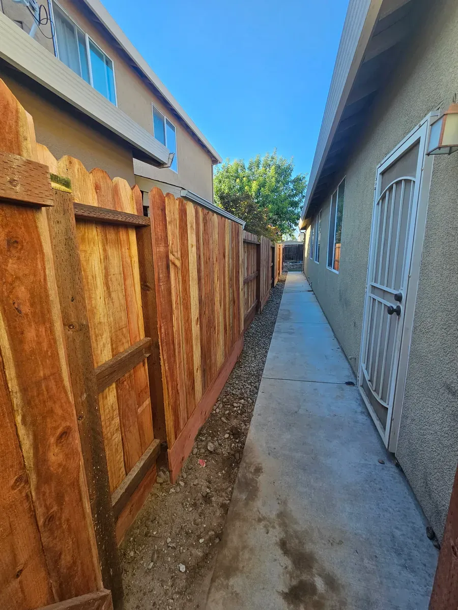Wood gate in a fence between two houses in Fresno, California