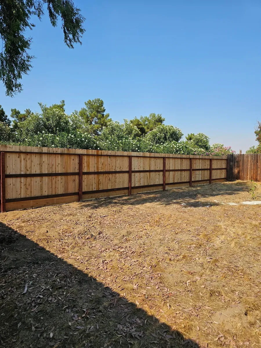Finished wood fence enclosing a backyard in Fresno, California