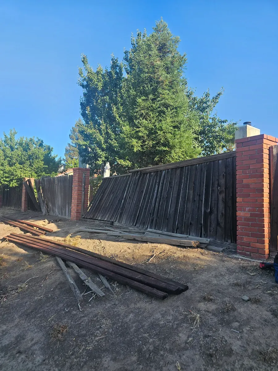 Fence repair with boards removed in Fresno, California